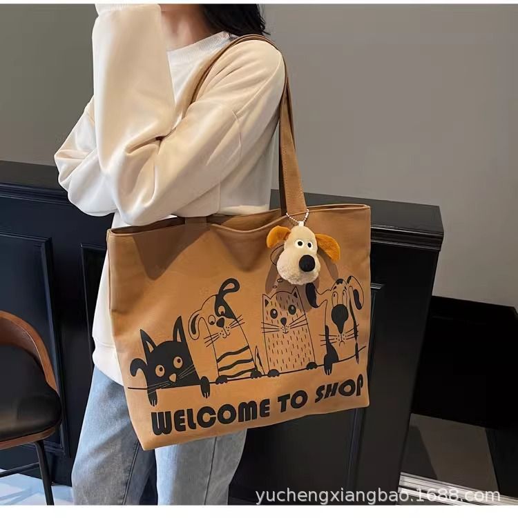 Leisure large capacity canvas bag for women 2025 new lightweight and versatile commuting shoulder bag graffiti tote bag