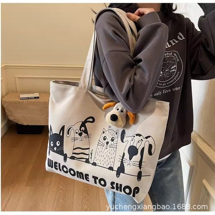 Leisure large capacity canvas bag for women 2025 new lightweight and versatile commuting shoulder bag graffiti tote bag