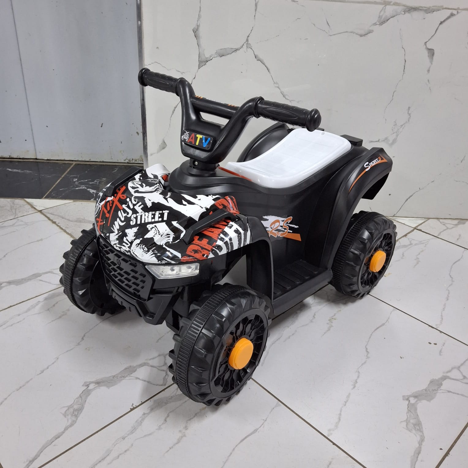 Kids Mini quad bike 
Uses rechargeable battery
Comes with adapter charger
Ages 2-4.5yrs