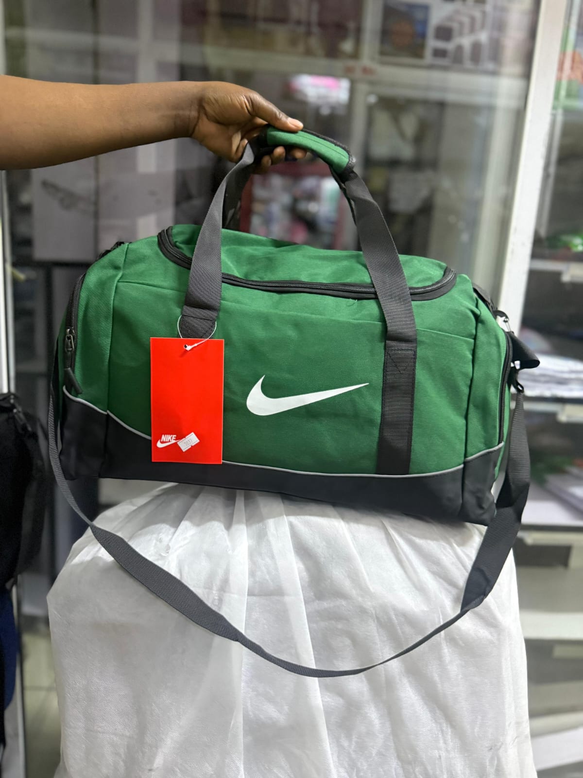 NEW IN 🔥🔥🔥Nike Duffle /gym Bag
✅ Spacious design with separate shoe compartment
✅Has a wet clothes compartment on the inside 
✅well partitioned 
📏 dimensions: 50cm (L) x 25cm (W) x 28cm (H)
🧳 Id