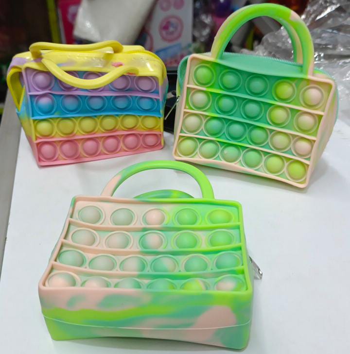 🟣pop it kids bags
🔖uniquely designed with the most popular pop bubble toys. 

It is not only a fashionable shoulder bag, but also a pop toy that you can press bubbles at any time to relax. 

Safe an