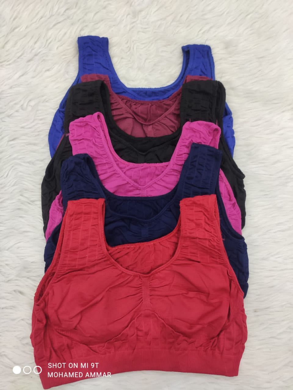 wireless sports bras with a ruched front design and likely featuring removable pads.