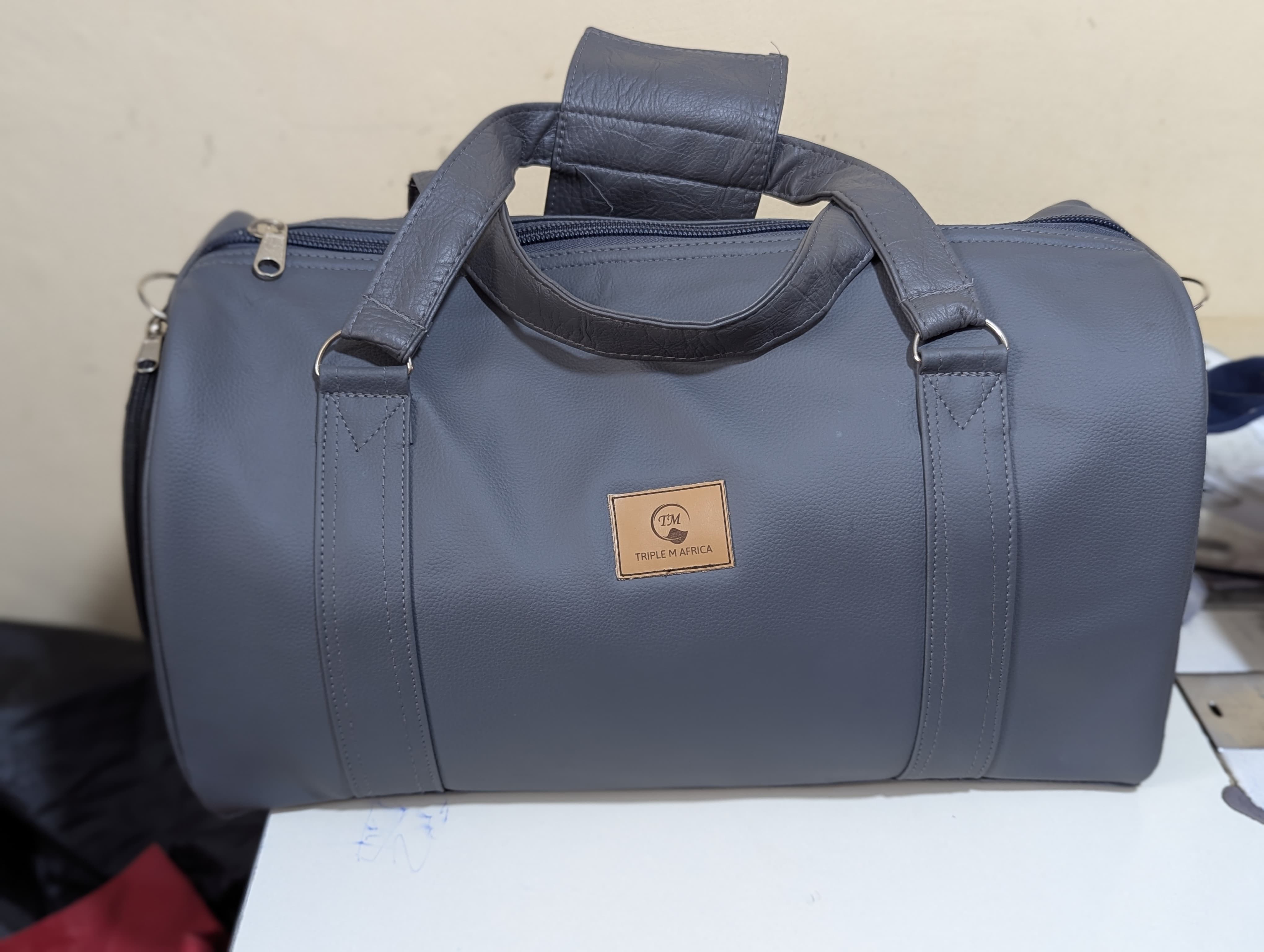 GYM BAG ⚡Water proof leather travel bag with a shoe pocket special only for a pair of shoe⚡and a laptop compart pocket inside , Easy to carry either by hand or shoulder an also at backside😍colours😍