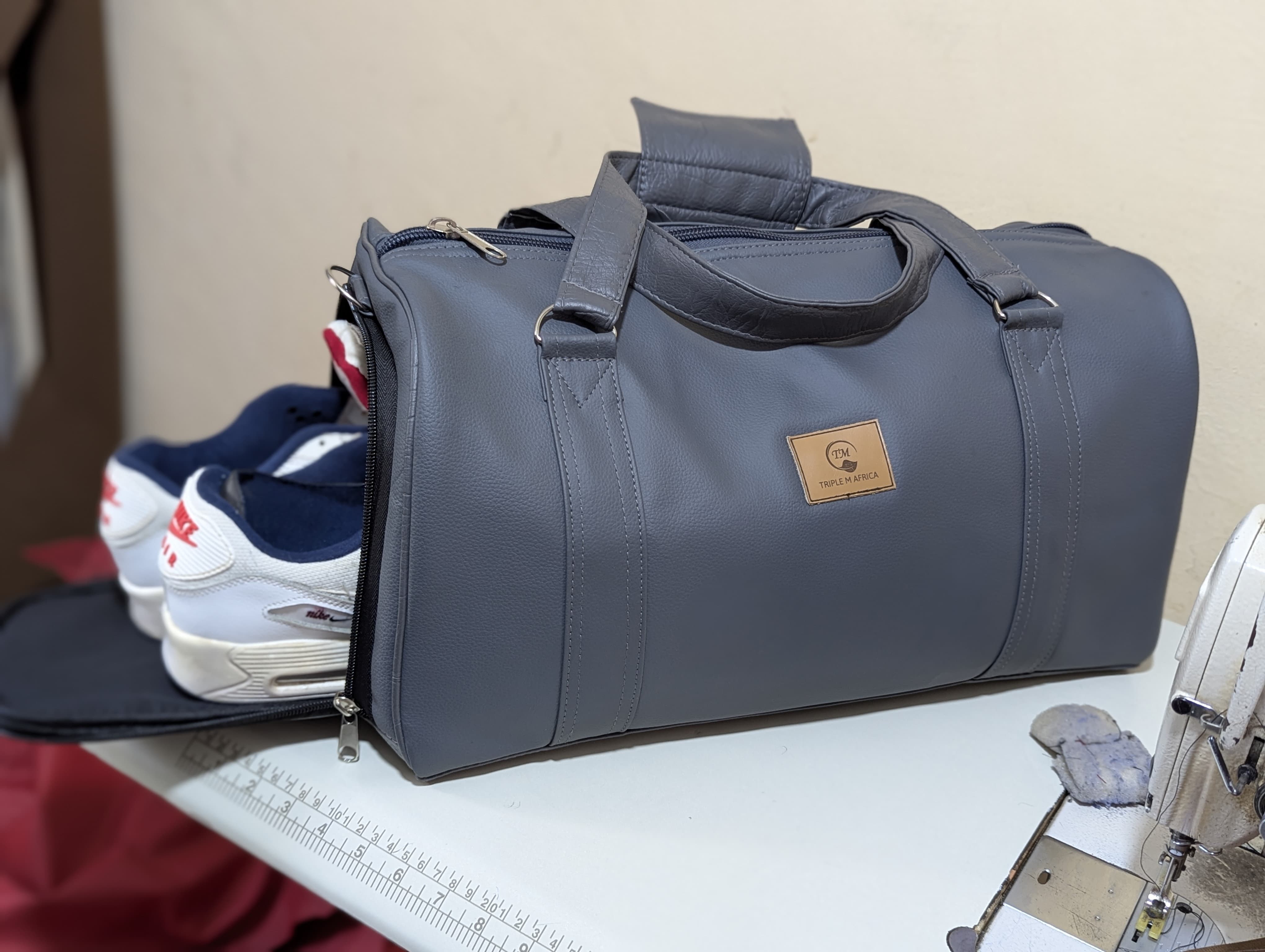 GYM BAG ⚡Water proof leather travel bag with a shoe pocket special only for a pair of shoe⚡and a laptop compart pocket inside , Easy to carry either by hand or shoulder an also at backside😍colours😍
