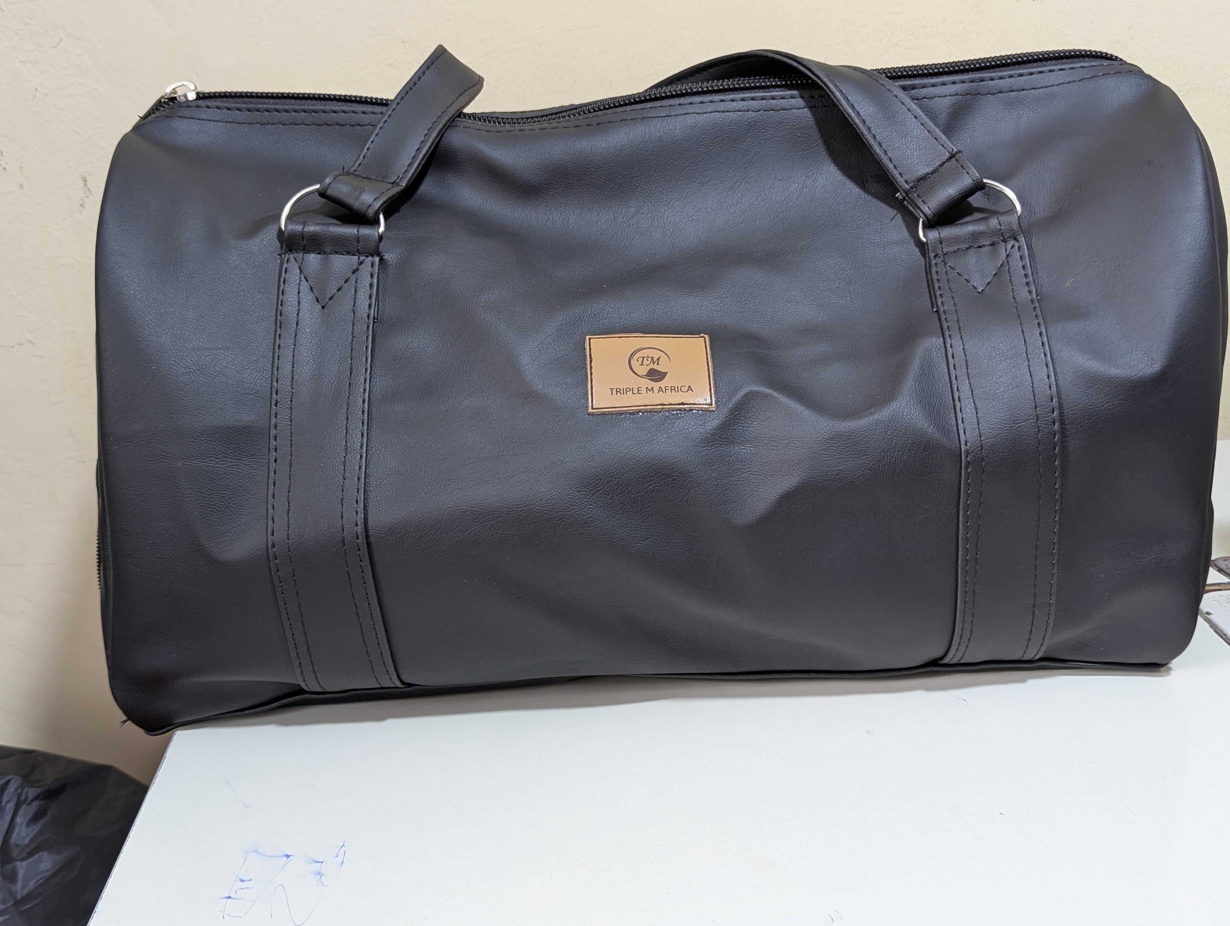 GYM BAG ⚡Water proof leather travel bag with a shoe pocket special only for a pair of shoe⚡and a laptop compart pocket inside , Easy to carry either by hand or shoulder an also at backside😍colours😍