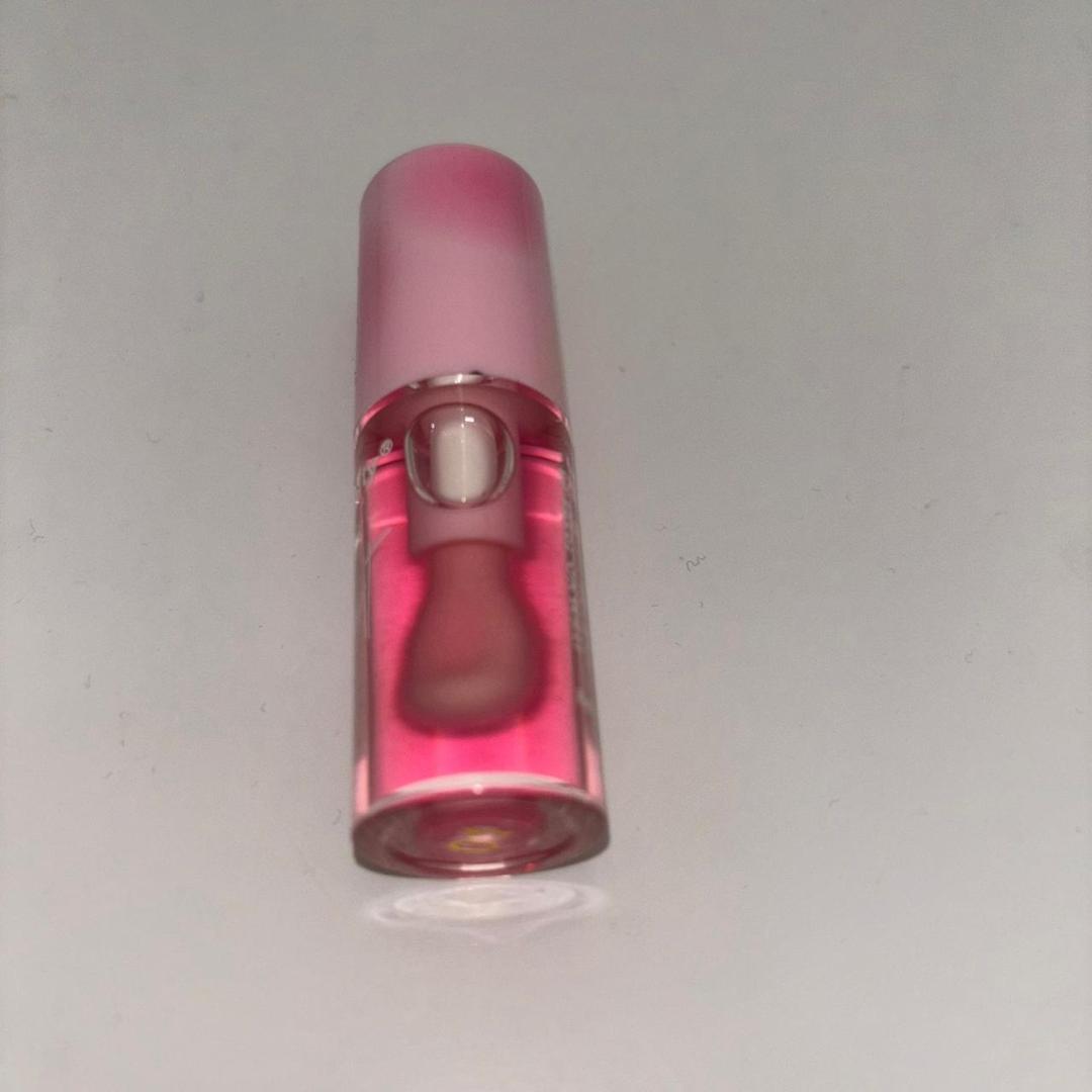 Kiss beauty lip oil. It hydrates your lips making them moist also removes hyperpigmentation making them pink
