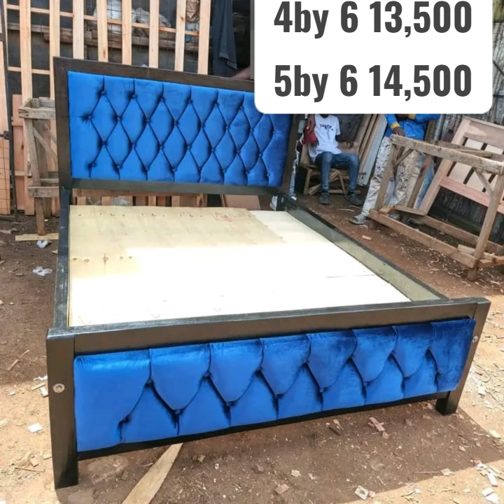 Mocket bed frame featuring a tufted upholstered headboard