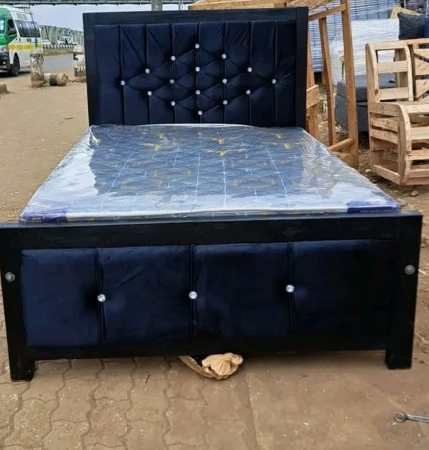 Mocket bed frame featuring a tufted upholstered headboard with NO MATTRESS