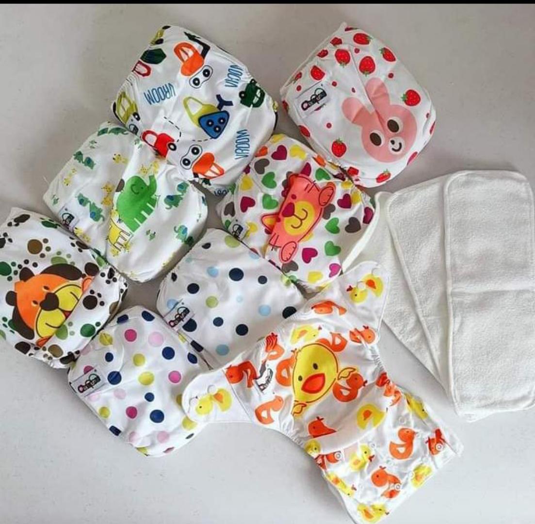 1 Heavy baby Rompers + 3 light baby rompers different colours+  2 sets washable baby Diapers (3 nappies in a set)+ 3 disposable pants sets( 5 pant pieces in a set)