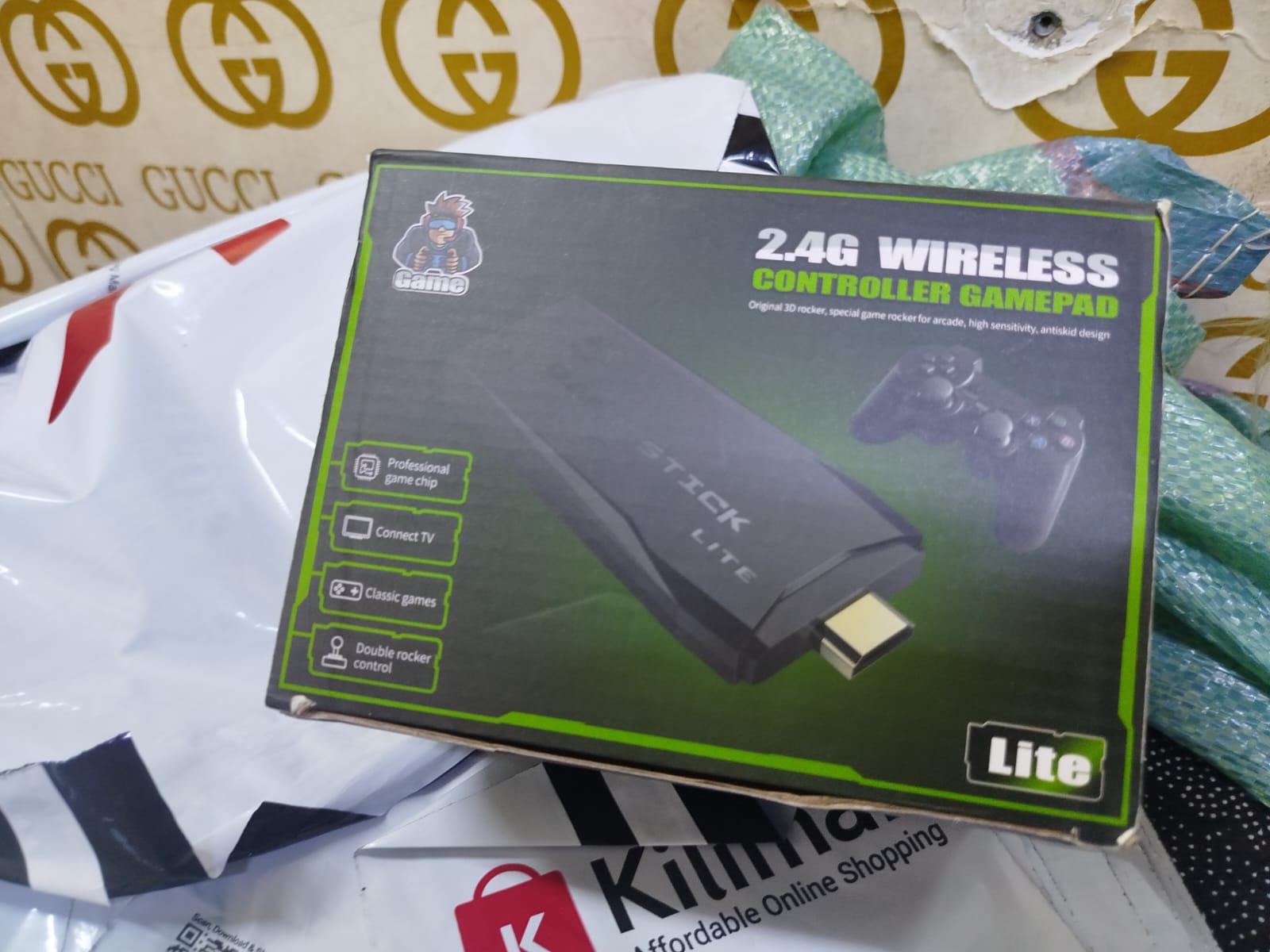 2.4G Wireless Controller Gamepad, which is part of a retro game console system often referred to as a "Game Stick Lite" or "Funtell Wireless Retro Game Console". 
Key features of this product include: