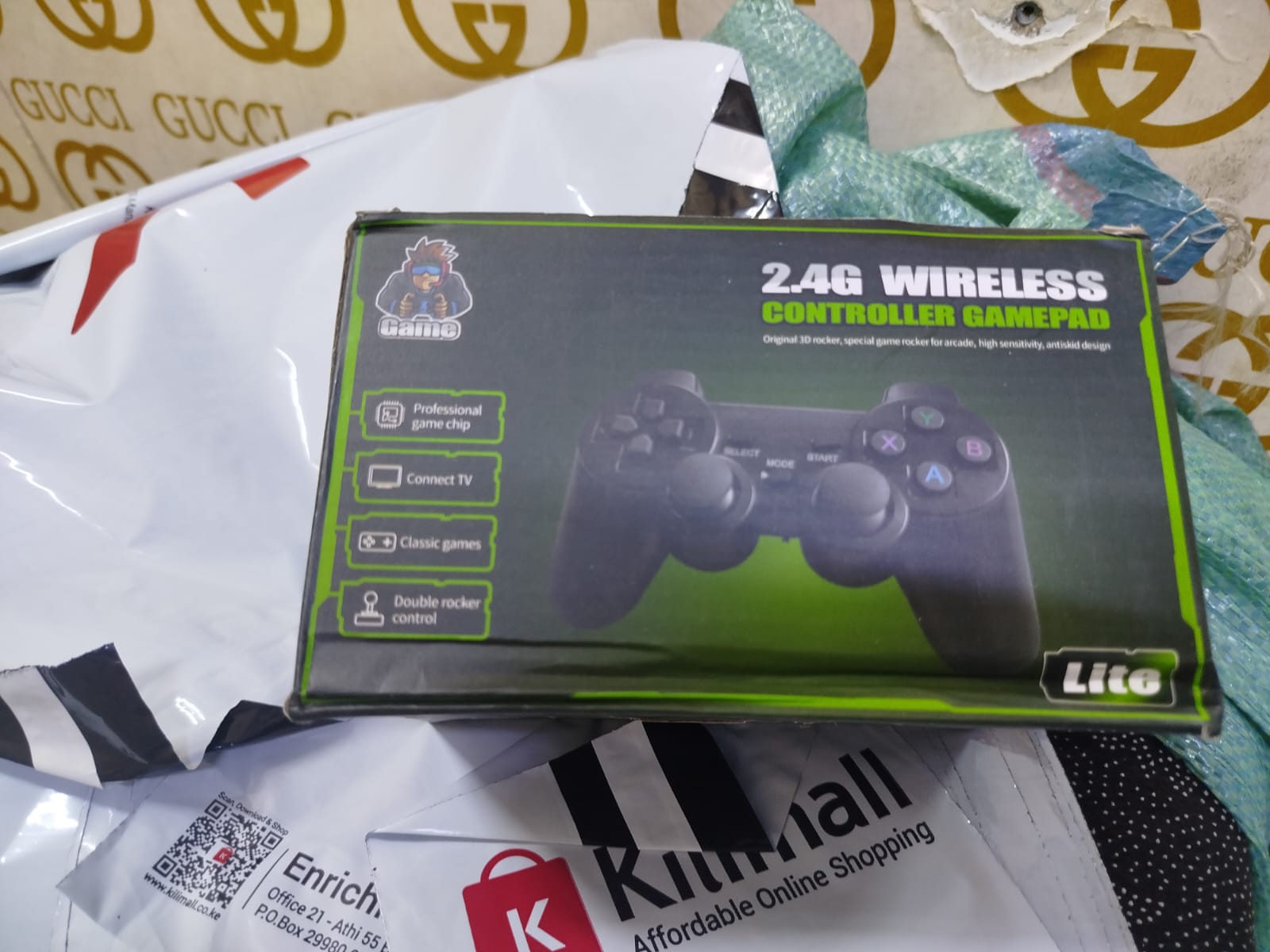 2.4G Wireless Controller Gamepad, which is part of a retro game console system often referred to as a "Game Stick Lite" or "Funtell Wireless Retro Game Console". 
Key features of this product include: