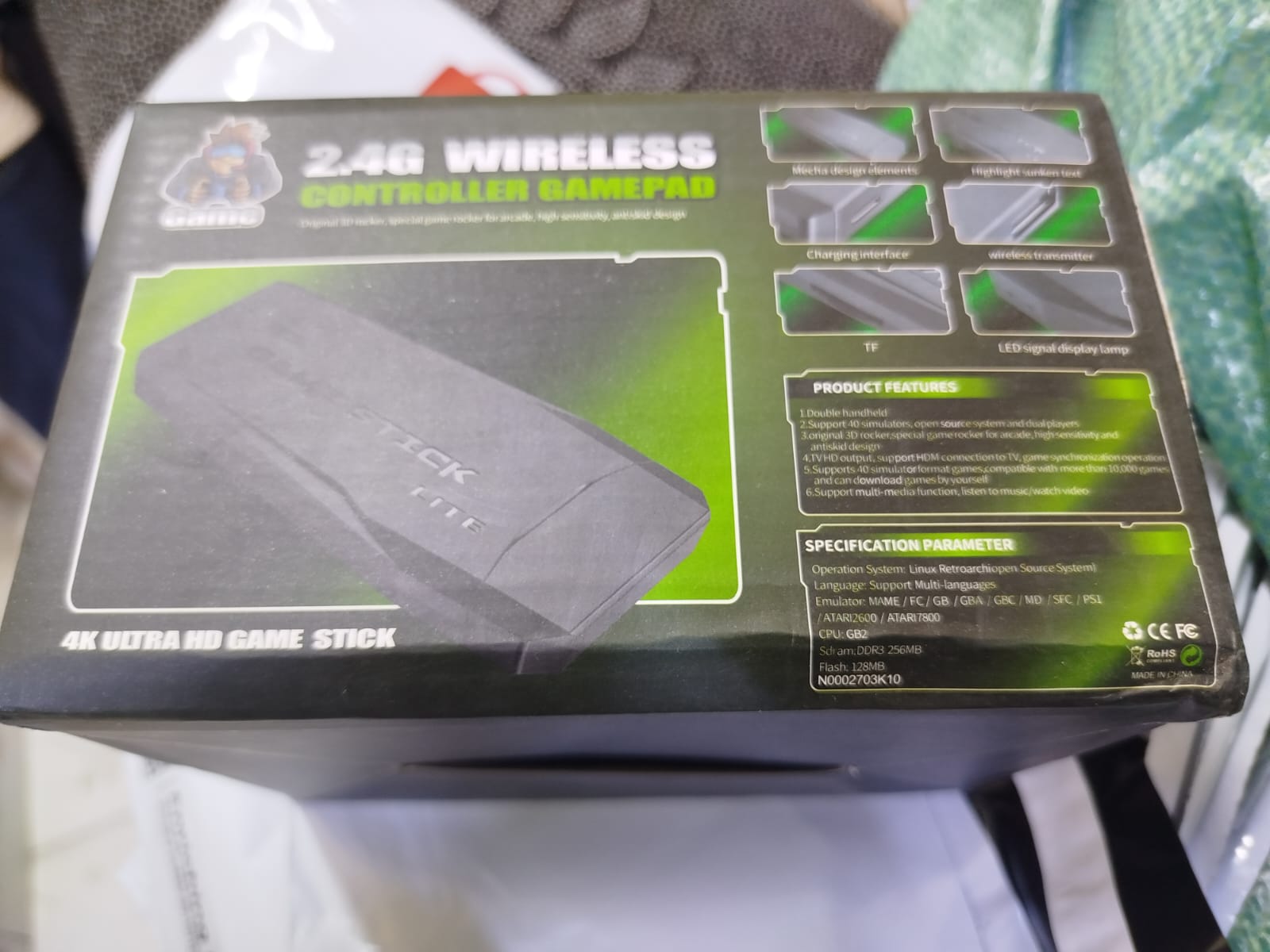 2.4G Wireless Controller Gamepad, which is part of a retro game console system often referred to as a "Game Stick Lite" or "Funtell Wireless Retro Game Console". 
Key features of this product include: