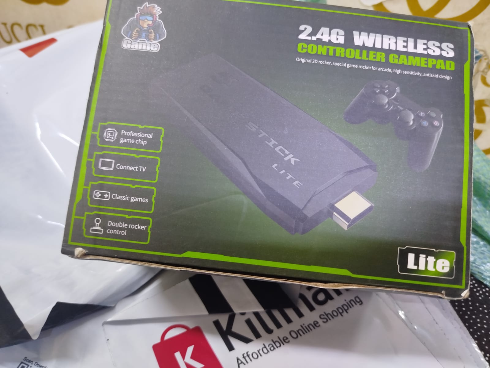 2.4G Wireless Controller Gamepad, which is part of a retro game console system often referred to as a "Game Stick Lite" or "Funtell Wireless Retro Game Console". 
Key features of this product include: