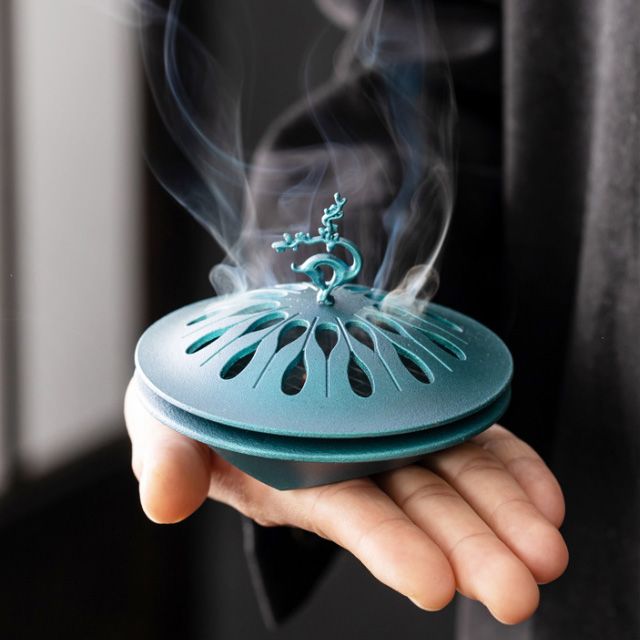 Auspicious Deer Incense Burner - A Zen - inspired Table Decoration. It's a sandalwood alloy incense burner with a tray.
