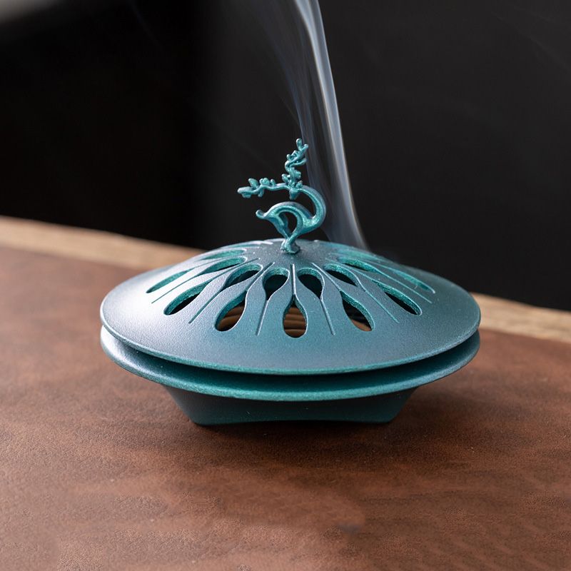 Auspicious Deer Incense Burner - A Zen - inspired Table Decoration. It's a sandalwood alloy incense burner with a tray.