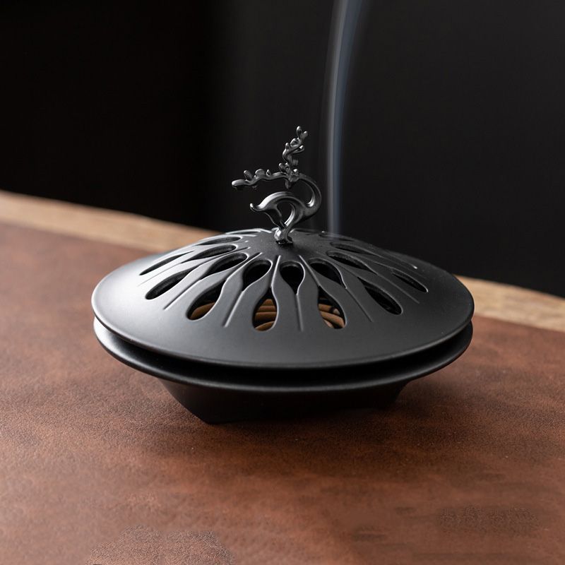 Auspicious Deer Incense Burner - A Zen - inspired Table Decoration. It's a sandalwood alloy incense burner with a tray.