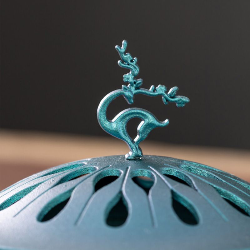 Auspicious Deer Incense Burner - A Zen - inspired Table Decoration. It's a sandalwood alloy incense burner with a tray.
