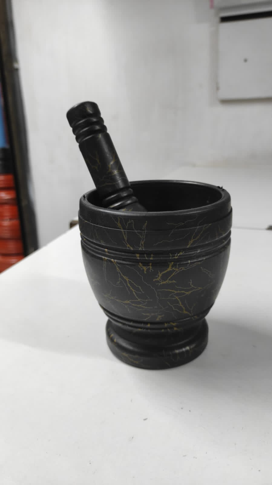 Black marble design pestle and mortar, spice grinder, herbs grinder, ginger and turmeric grinder. Kitchen spice grinder