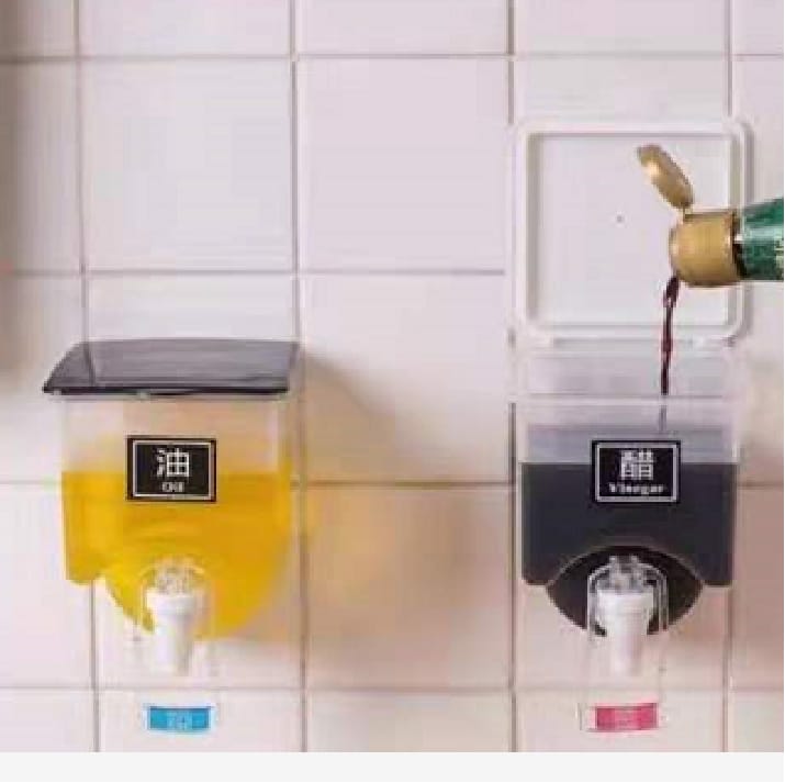 Wall Mounted 750mL Oil / Liquids Dispenser with tap and a lid that can hold weights now available reduced price Comes with adhesive sticker and 4 sticker labels- KINDLY WATCH VIDEO