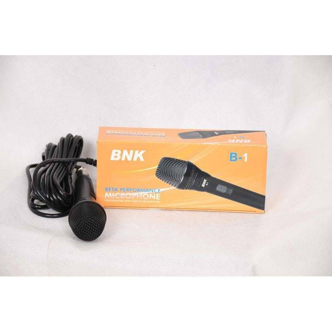 NK B-1 wired handheld dynamic microphone placed beside its original packaging box, on/off slider switch located in the middle of the microphone’s handle for easy control during use.