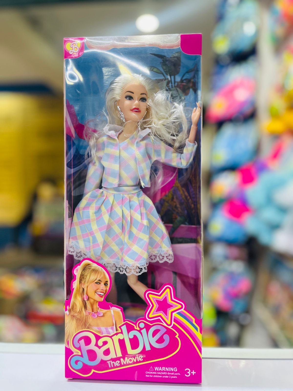 Barbie The Movie Doll - Stylish Blonde Fashion Doll with Plaid Dress, Perfect Gift for Girls 3+ Years, Collectible Toy Delight your little one with the Barbie The Movie Doll