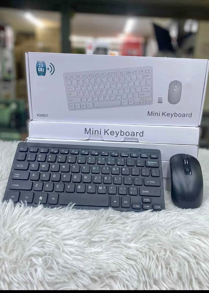 Mini wireless keyboard and mouse compatible with all laptops and desktop computers since it uses bluetooth connection and has a rechargable battery with a wireless mouse connected to it though doungle