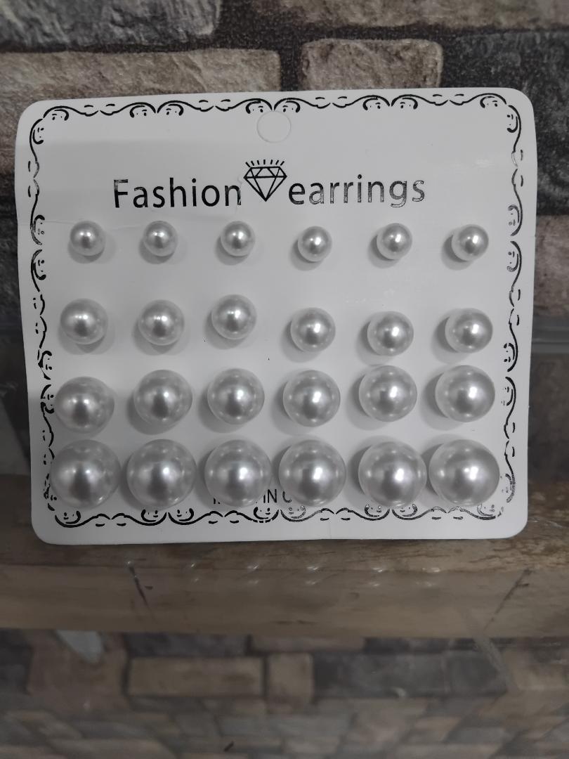 12-pair set of white pearl stud earrings is perfect for wedding occasions. Featuring mixed sizes, hypoallergenic design, and tarnish-resistant materials, these elegant studs offer timeless beauty