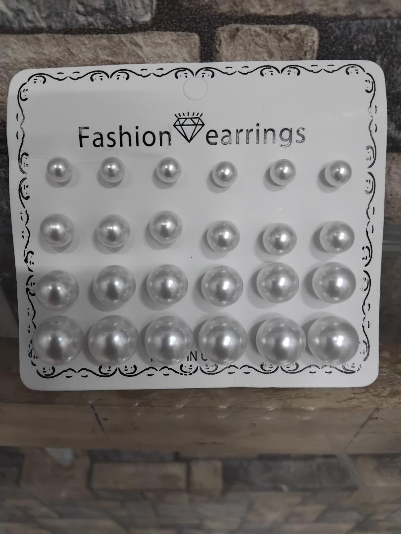 12-pair set of white pearl stud earrings is perfect for wedding occasions. Featuring mixed sizes, hypoallergenic design, and tarnish-resistant materials, these elegant studs offer timeless beauty