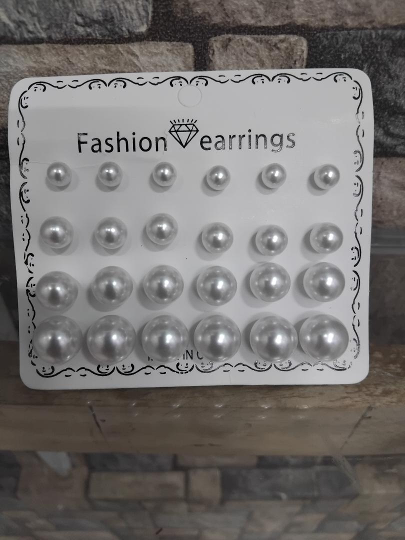 12-pair set of white pearl stud earrings is perfect for wedding occasions. Featuring mixed sizes, hypoallergenic design, and tarnish-resistant materials, these elegant studs offer timeless beauty