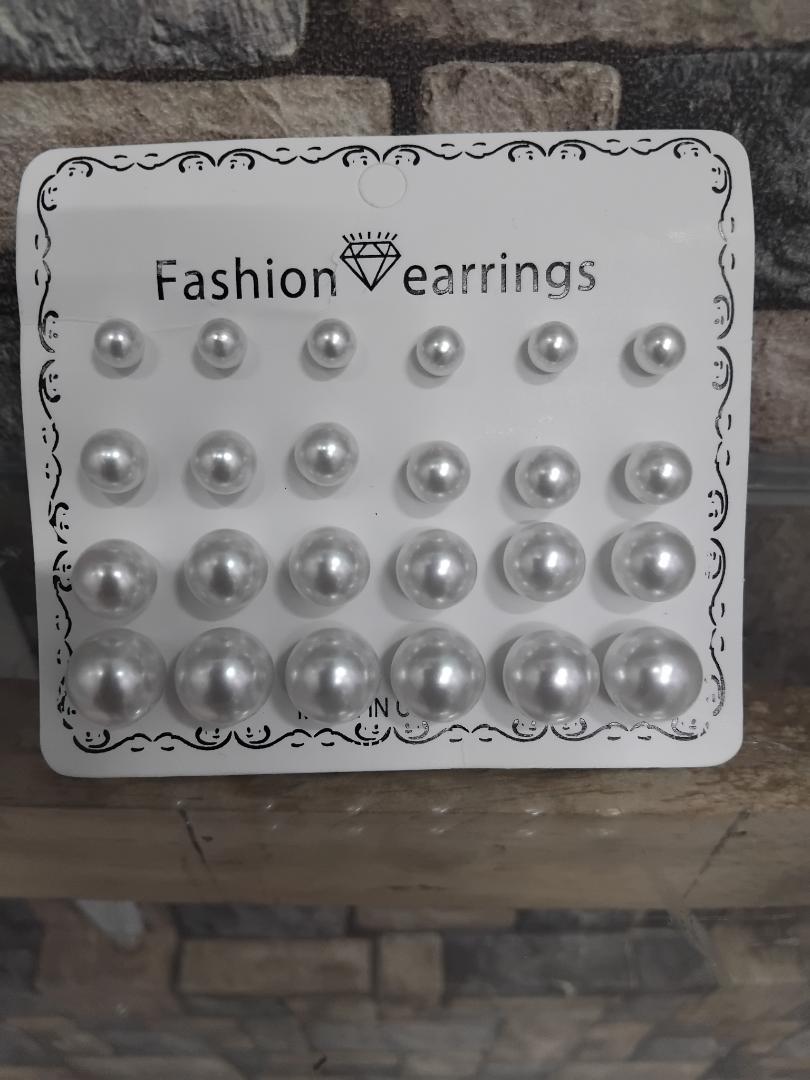 12-pair set of white pearl stud earrings is perfect for wedding occasions. Featuring mixed sizes, hypoallergenic design, and tarnish-resistant materials, these elegant studs offer timeless beauty