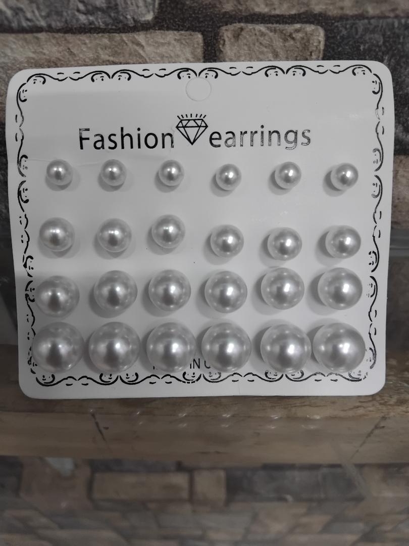 12-pair set of white pearl stud earrings is perfect for wedding occasions. Featuring mixed sizes, hypoallergenic design, and tarnish-resistant materials, these elegant studs offer timeless beauty
