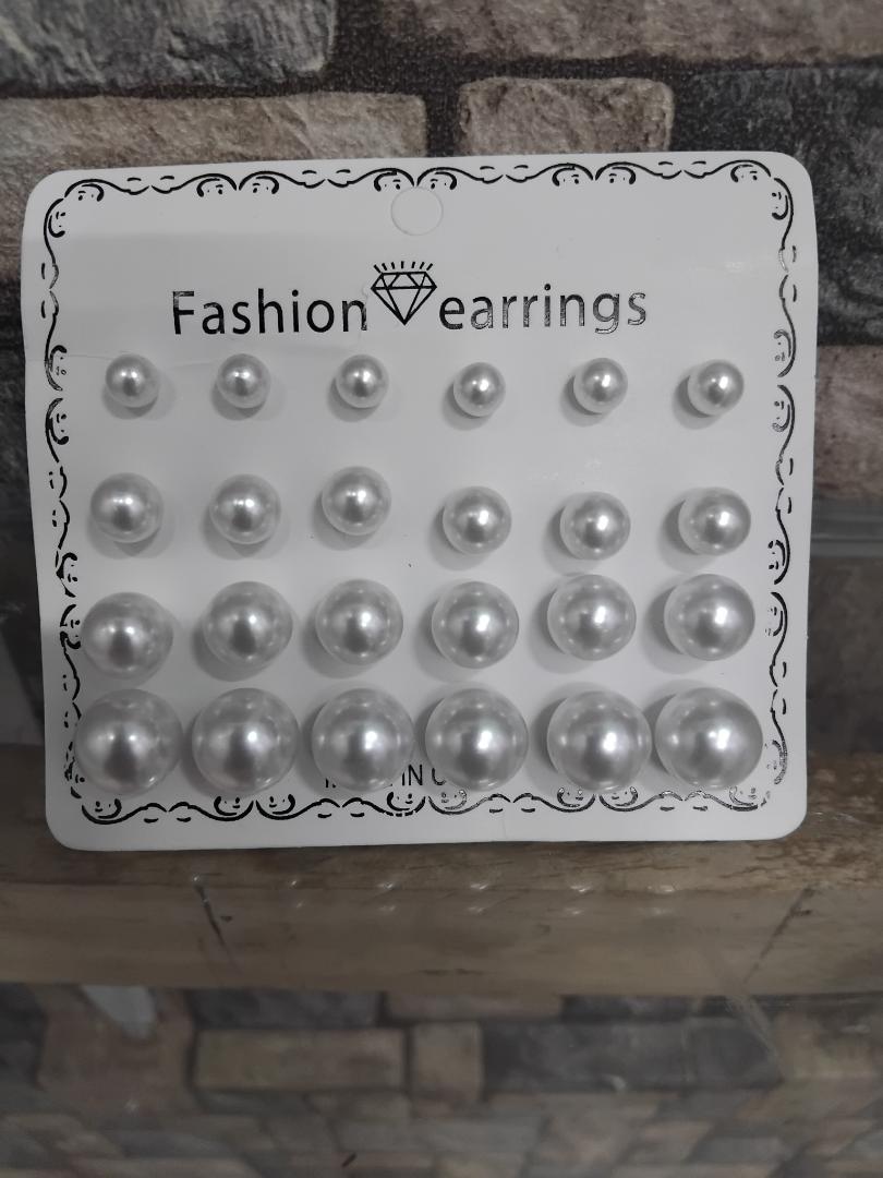 12-pair set of white pearl stud earrings is perfect for wedding occasions. Featuring mixed sizes, hypoallergenic design, and tarnish-resistant materials, these elegant studs offer timeless beauty