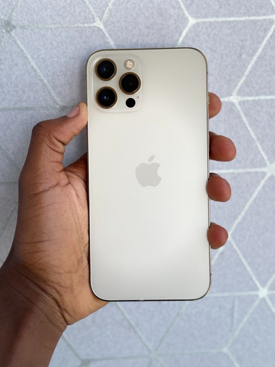 New IPHONE 12 PRO MAX IN GOLD WITH 256GB OF STORAGE. A 6.7-INCH SUPER RETINA XDR DISPLAY A PERFECTLY WORKING FACE ID AND TRUETONE ENABLED 90% BATTERY CAPACITY.