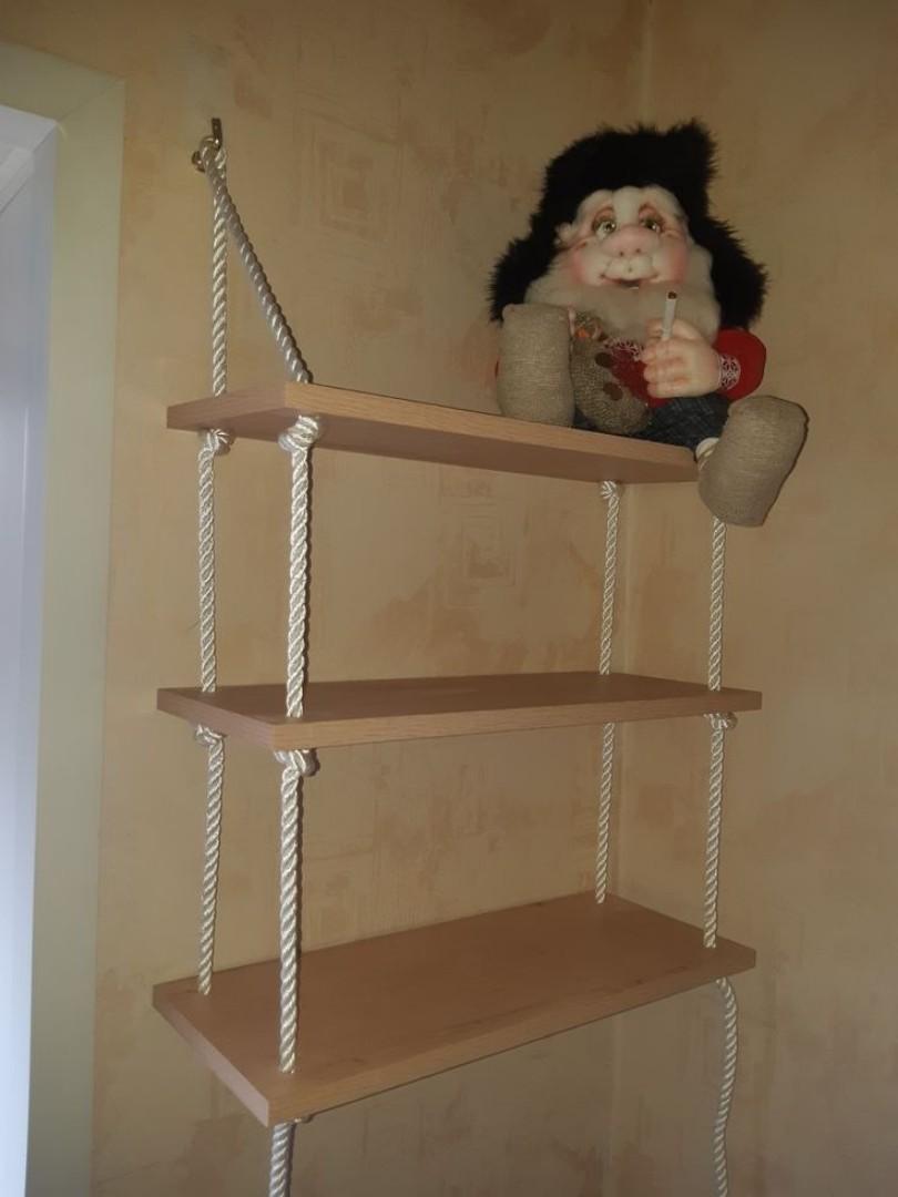 Three tiers of natural  wood floating shelves Durable rope for a rustic, suspended look