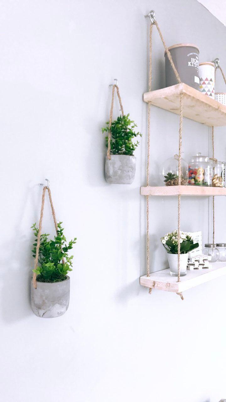 Three tiers of natural  wood floating shelves Durable rope for a rustic, suspended look