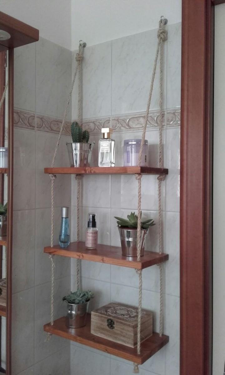 Three tiers of natural  wood floating shelves Durable rope for a rustic, suspended look