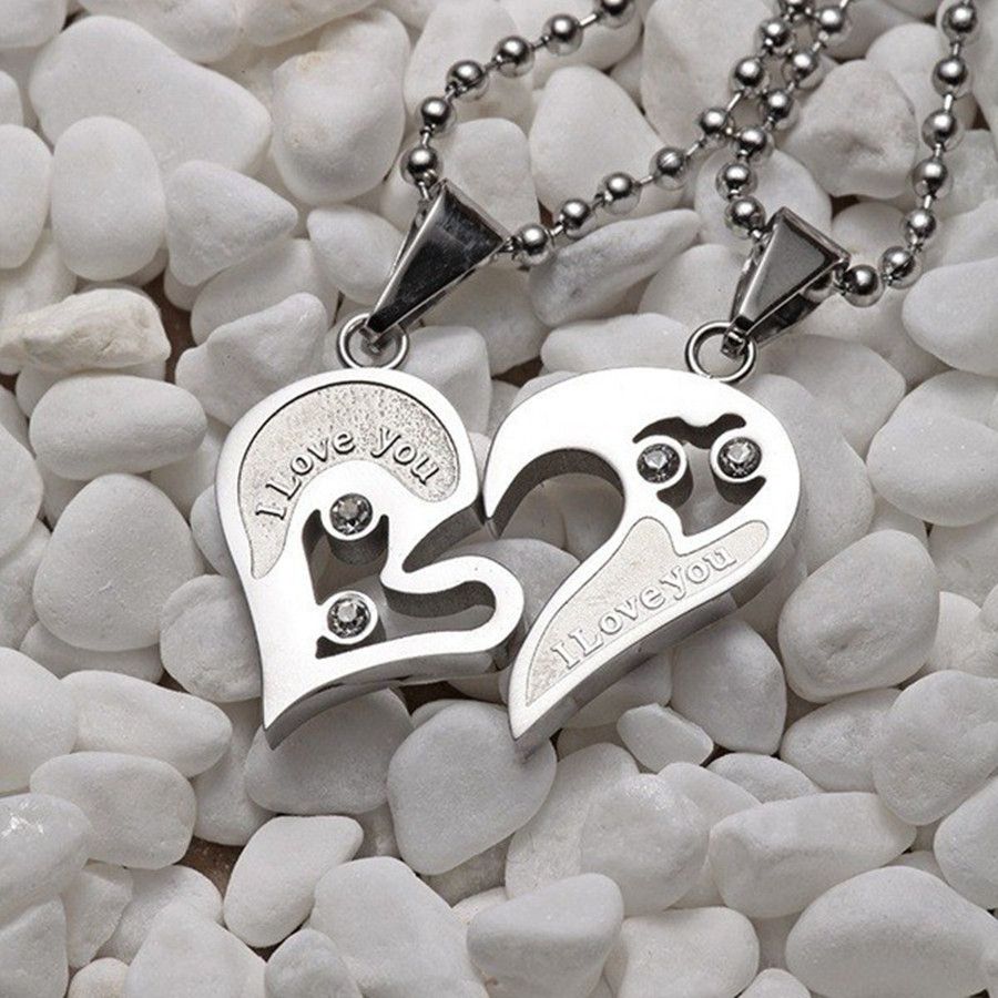 A pair of heart-shaped diamond-encrusted pendants with a bead chain love couple necklace