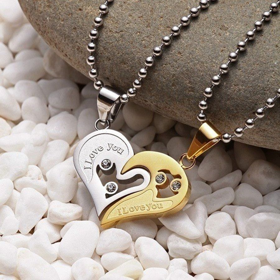 A pair of heart-shaped diamond-encrusted pendants with a bead chain love couple necklace