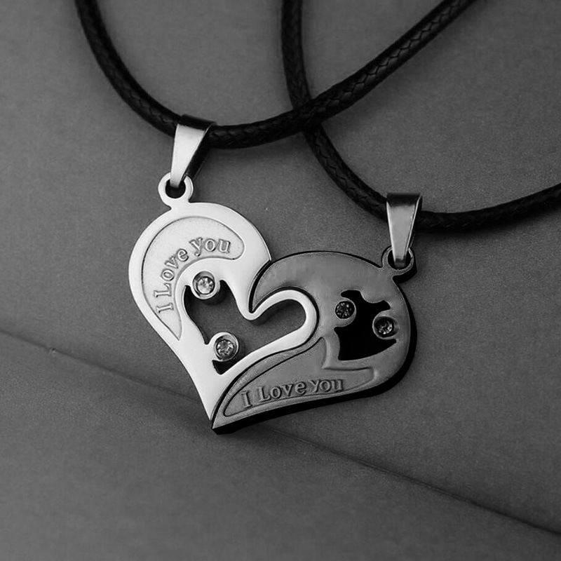 A pair of heart-shaped diamond-encrusted pendants with a bead chain love couple necklace