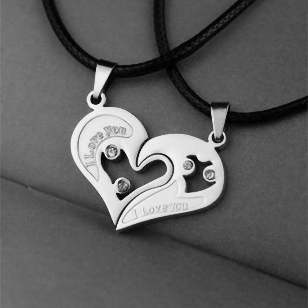 A pair of heart-shaped diamond-encrusted pendants with a bead chain love couple necklace