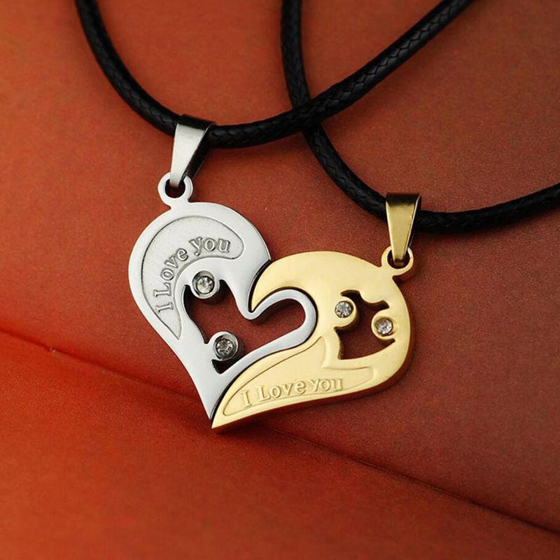 A pair of heart-shaped diamond-encrusted pendants with a bead chain love couple necklace
