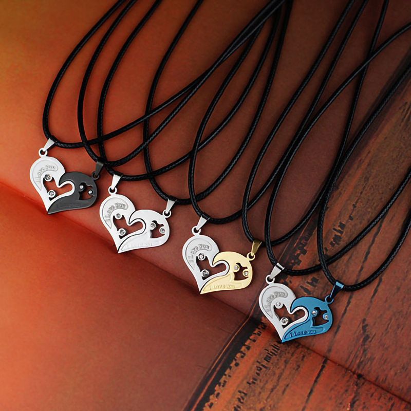 A pair of heart-shaped diamond-encrusted pendants with a bead chain love couple necklace