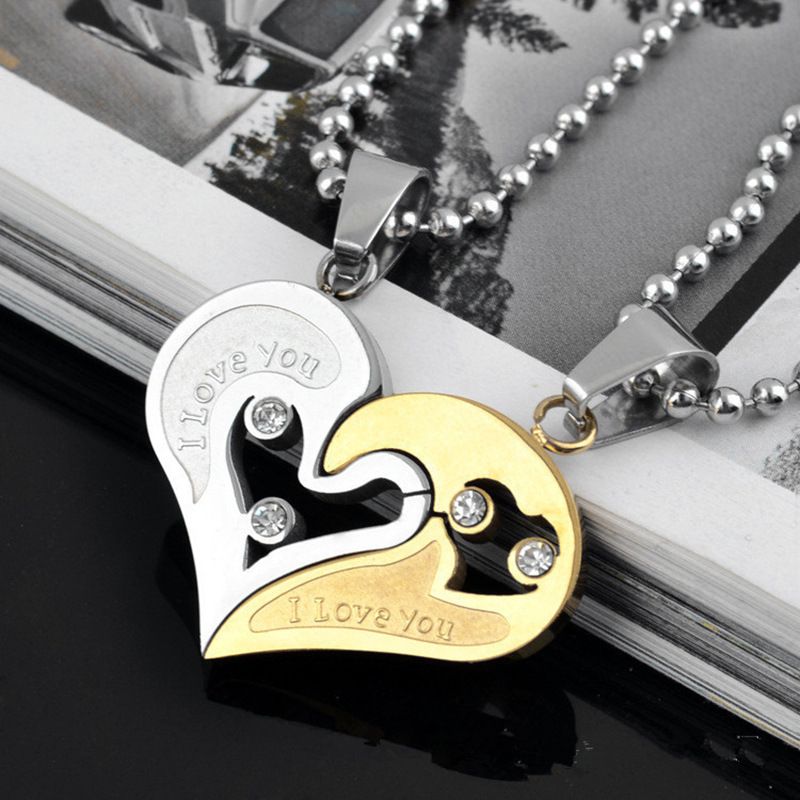A pair of heart-shaped diamond-encrusted pendants with a bead chain love couple necklace