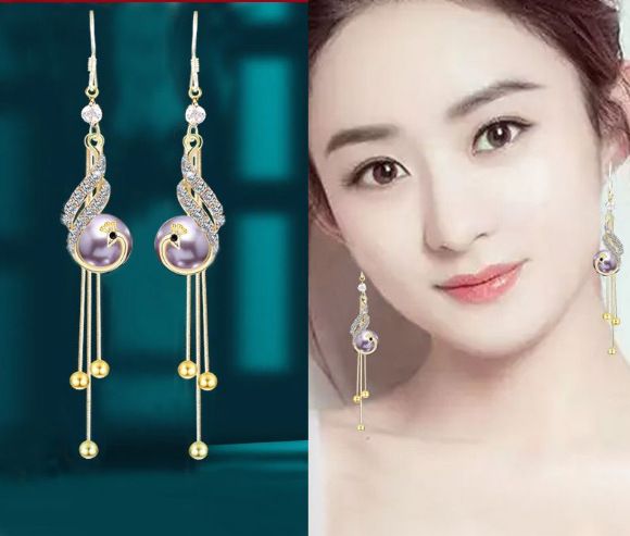New cat eye stone tassel earrings for women with a high-end and elegant temperament. Long earrings with fashionable and versatile hooks and earrings