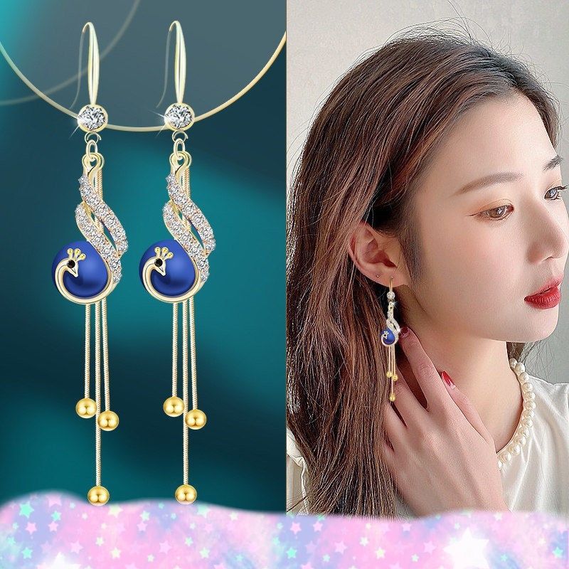 New cat eye stone tassel earrings for women with a high-end and elegant temperament. Long earrings with fashionable and versatile hooks and earrings