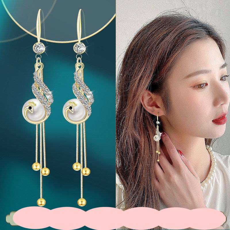 New cat eye stone tassel earrings for women with a high-end and elegant temperament. Long earrings with fashionable and versatile hooks and earrings