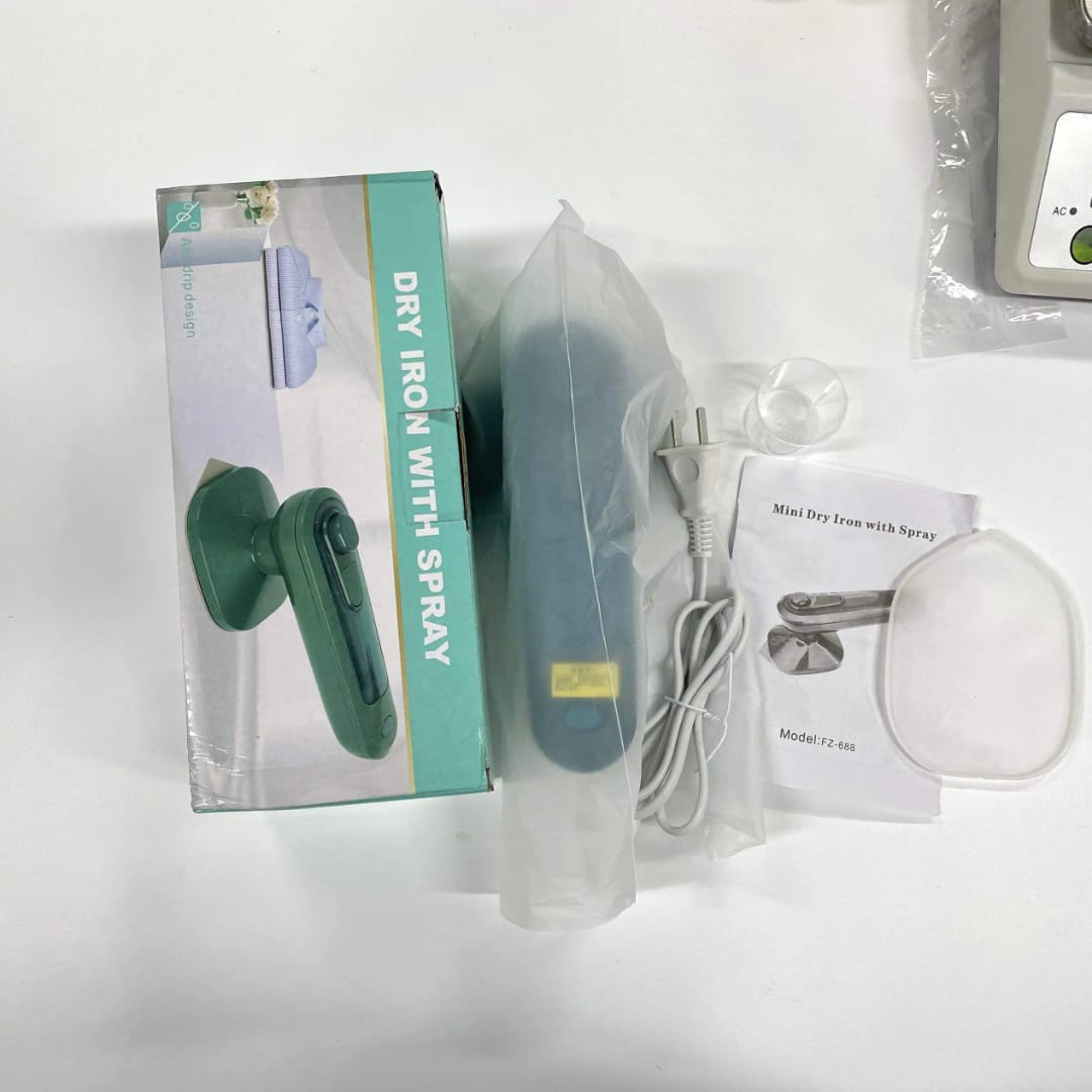 TRAVEL MINI IRON  WITH STEAM SPRAY--Two-in-one design, dry and wet steam to emit wrinkled, busting quickly and efficiently. The handle can be rotated 180 degrees, buttons and collars.