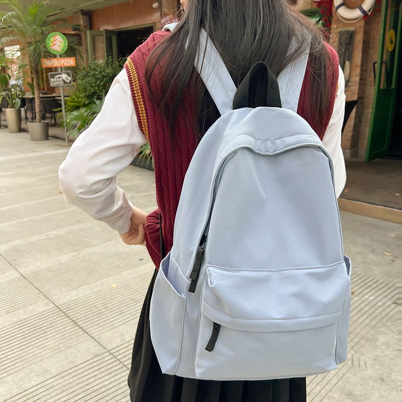 Japanese style unprinted backpack for male and female college students, Korean version, large capacity solid color backpack, middle and high school student backpack