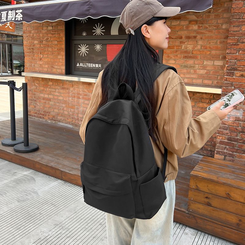 Japanese style unprinted backpack for male and female college students, Korean version, large capacity solid color backpack, middle and high school student backpack