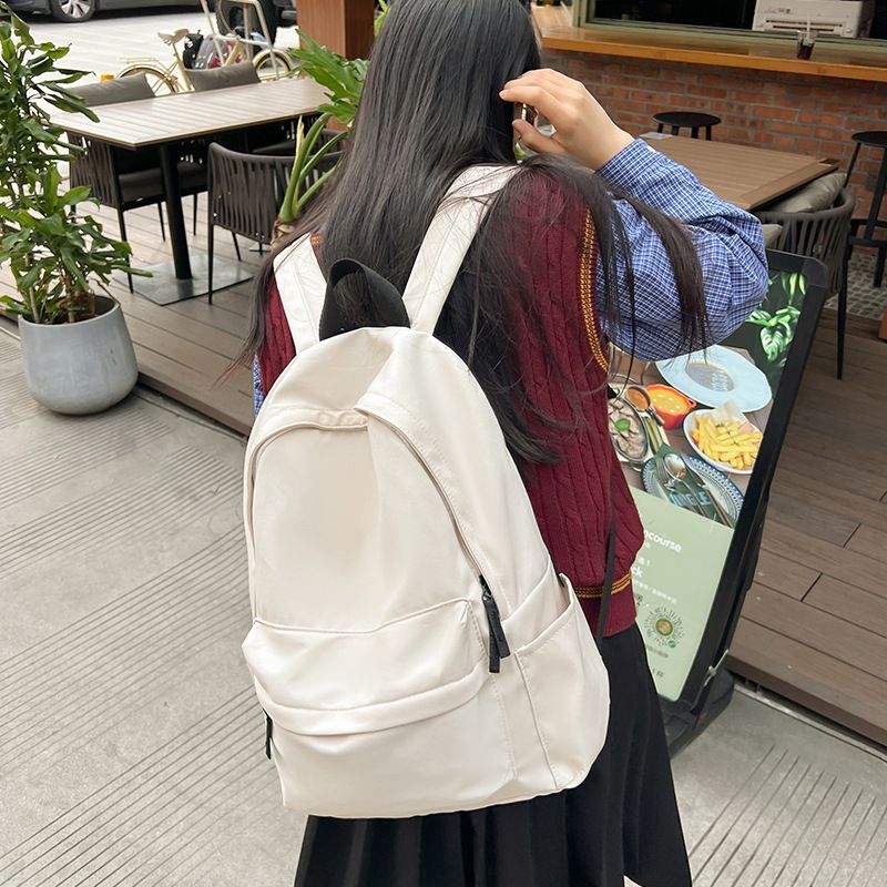 Japanese style unprinted backpack for male and female college students, Korean version, large capacity solid color backpack, middle and high school student backpack